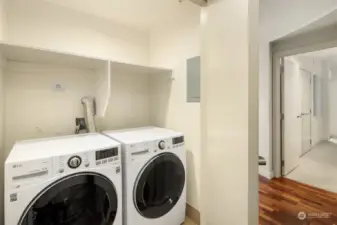 Laundry closet with storage at entry