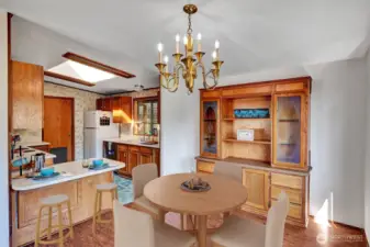 Dining room area will easily accommodate a 6 ti 8 table seating. Breakfast bar area for those quick meals.