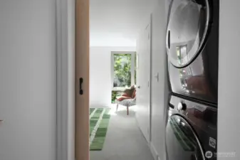 In-unit laundry tucked near the bedroom.