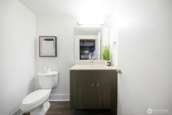 Main level powder bath, convenient for guests.