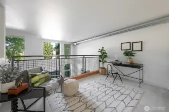 Versatile loft with tree-lined views, ideal for a home office, reading nook, or creative zone.