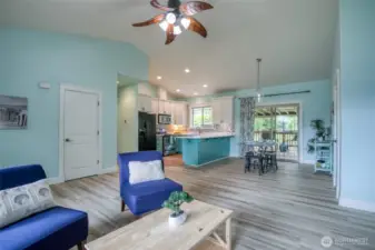 Open to kitchen and dining area