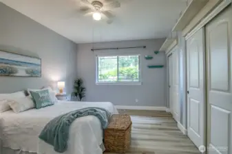 Primary bedroom with view of private back patio