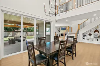 Two story dining area with double sliding doors.