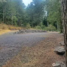 View from edge of lot near pump house towards driveway.