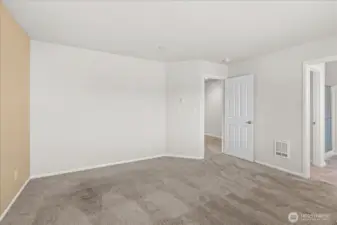 Another view of the primary bedroom