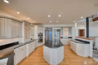 THE BACK DOOR ENTERS INTO THIS FABULOUS KITCHEN! THE CABINETS ARE LIGHTED AND PULL-OUT DRAWERS ARE FOR CONVENIENCE!