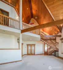 BACK THROUGH THE LIVING AREA TOWARD THE FRENCH DOORS TO THE PRIMARY BEDROOM!