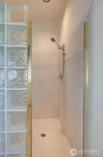 THE GLASSED IN SHOWER IS LARGE ENOUGH FOR TWO!