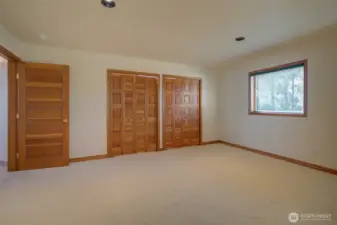 THE BEDROOMS CONTINUE WITH THE HARDWOOD TRIM AND CLOSET DOORS!