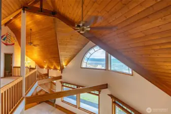 LOOKING OUT THE WINDOW TO ALL THE WOOD TRIM AND VIEW OF THE BAY THROUGH THE HALF-MOON WINDOW!