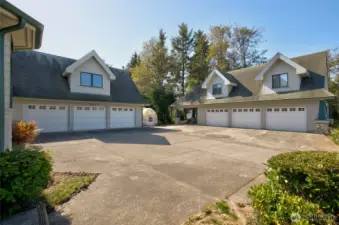 OUTSIDE THERE IS PLENTY OF PARKING AND TWO 3-CAR GARAGES AND A CARPORT!