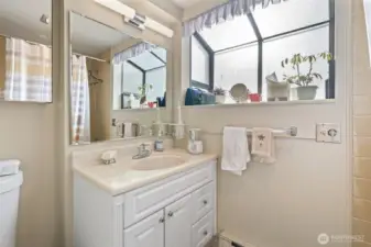 Main floor bathroom, has full tub/shower.