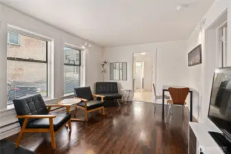 Ground floor unit living room with fantastic natural light. Wood floors, excellent ceiling height.