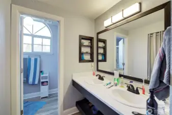 Primary 3/4 Bath with dual sinks and tile floors