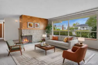 Huge window for tons of natural light, and great wood detail on the brick fireplace. Virtually staged.