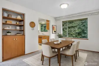 Spacious dining room with built in hutch. Virtually staged.