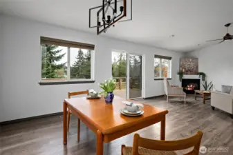 Windows and sliding glass door keep this open space bright and inviting.