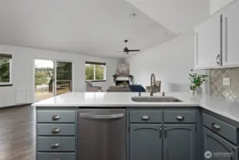 Newer quartz countertops and custom tile backsplash.