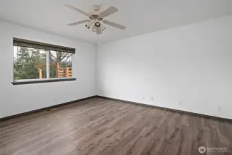 Bonus room with window facing backyard.