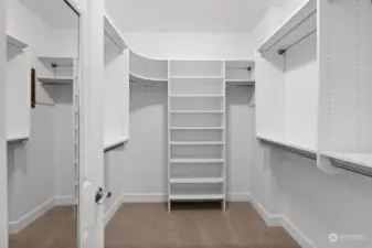 Discover the ultimate convenience in the primary bedroom with its expansive walk-in closet, equipped with custom shelving to meet all your closet organization needs.
