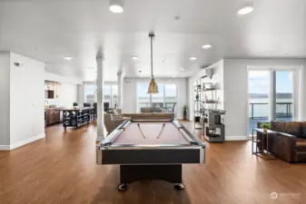 Enjoy the perks of living in this complex with not one but two entertainment rooms. This larger of the two boasts a pool table, a full kitchen, and multiple dining areas, making it a versatile and inviting space for social gatherings.