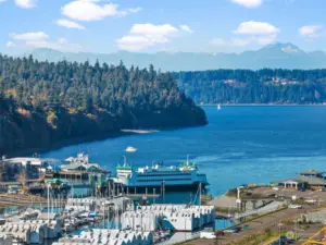 Savor the picturesque beauty of Tacoma, where the sound of the ferry and the sparkling waters create a mesmerizing view that's nothing short of enchanting.