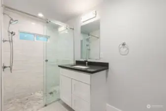 Master Bathroom with glass sliding shower door.