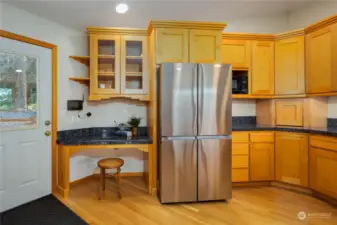 Great storage and convenient door directly into the kitchen from the upper level parking area.