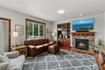 Large family room with gas fireplace and views of Mt. Baker and the cascades