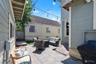 The fenced, back yard patio area is bright, open, and an ideal spot to entertain and relax.