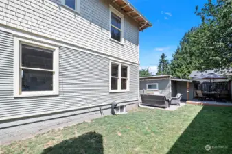 Large, well cared for side yard has room for play and would make a great spot for garden beds!