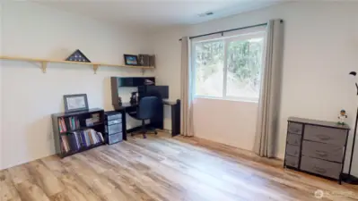 The fourth of four bedrooms, looking onto the backyard