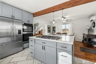 Spacious Kitchen with Gas Stove, and Oversized Stainless Fridge