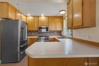 Kitchen is spacious and offers great cabinet space and gas stove.  All appliances are upgraded and newer.