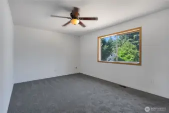 Primary bedroom with ceiling fan