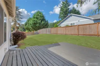 Expansive backyard and deck ready for entertaining