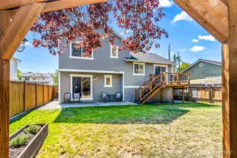 Large backyard with built in planter boxes.
