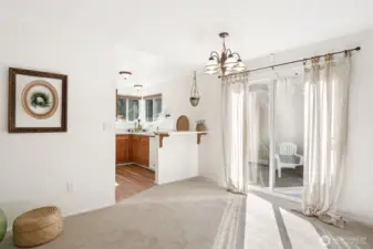 Another view of the dining room w/a slider leading to the patio.