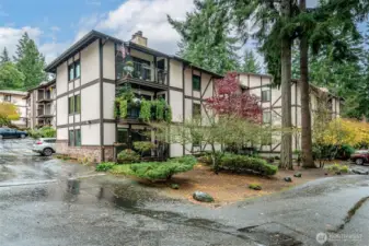 Northwest corner of the building that the unit is in and also situated on the Northwest section of the condominium complex. The unit is just left around the corner. The entrance to the building is near the 2 tall fir trees.