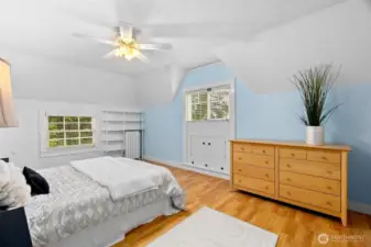 Bedroom #2 upstairs offers durable laminate floors plus ample built-in storage.