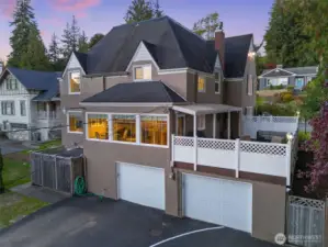 View of the back of the home. The two-car attached garage spaces are large and offer additional built in storage.