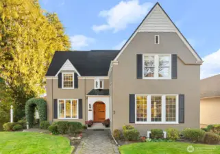 The welcoming and well-maintained front yard and porch sets the tone for this historic home.