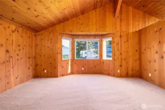 Living Room with bay window and vaulted ceiling.