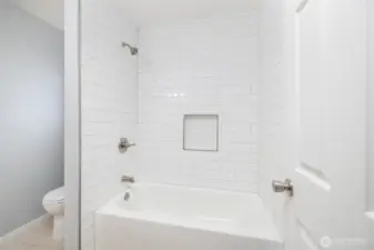 Floor to ceiling tile bath