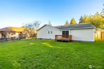 Back yard has lots of space for gardening or yard games.