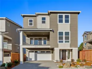 The Crystal Home Plan. Striking three-level home with modern farmhouse-inspired architecture, highlighted by rich siding details, oversized windows, and a welcoming covered entry. A two-car garage and thoughtful landscaping complete the curb appeal, all set within the desirable Foxmoore community.    All photos, renderings, site maps, and floorplans are for visualization purposes only. Plans, colors, building orientation, finishes, home outlook, and other details can and WILL vary.