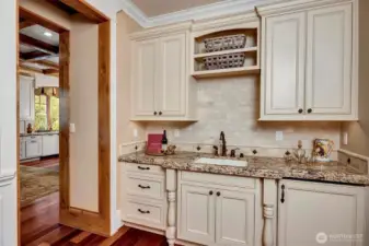 Butler's pantry with beverage fridge  and sink