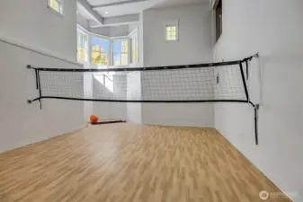 Down a flight of stairs you will find the gym. While this is set up for volley ball, it could be basket ball or any sport you would desire. Note how tall the ceilings are