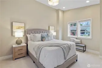 Second bedroom with custom closet organizer.